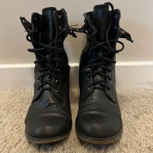 Black combat boots with black studes